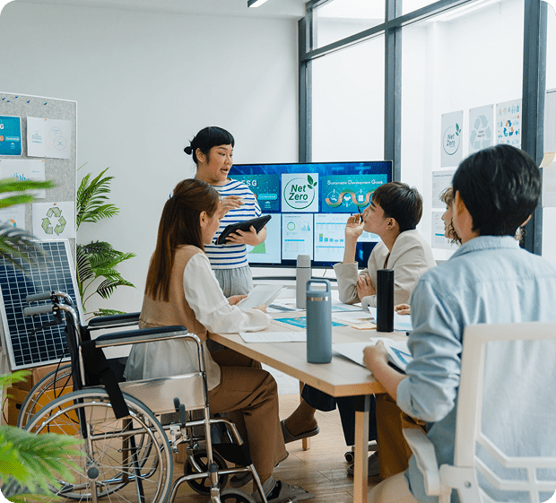 Team discussing sustainability in modern conference room.