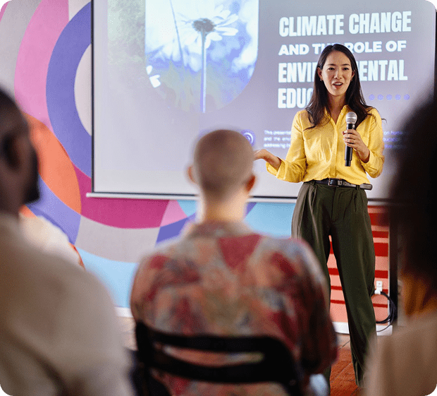 Speaker presenting on climate change education.