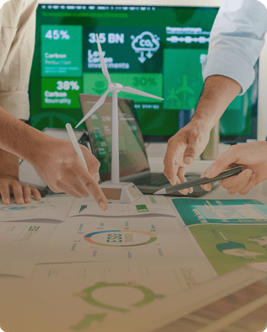 People discussing sustainability with charts and models.